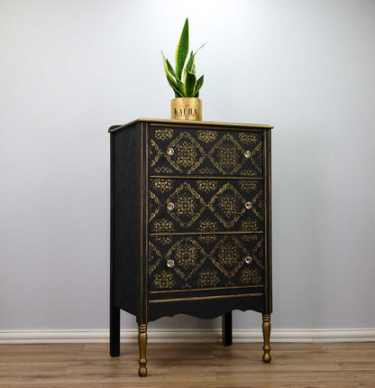 Stencil Modern Moroccan Kacha en cómoda alta negra con patas doradas restaurada - patrón geométrico marroquí dorado en cajones, tiradores de cristal - Re-Design with Prima - ambassador Kacha
